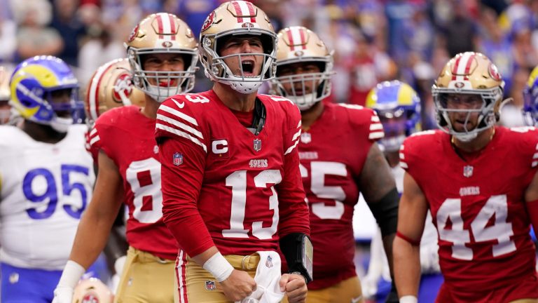 San Francisco 49ers quarterback Brock Purdy, centre, celebrates after running in for a touchdown during the first half of an NFL football game against the Los Angeles Rams Sunday, Sept. 17, 2023, in Inglewood, Calif. (Ashley Landis/AP)