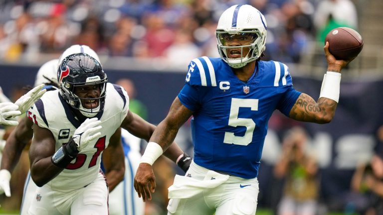 Indianapolis Colts quarterback Anthony Richardson (5) is pursued by Houston Texans defensive end Will Anderson Jr. (51) in the first half of an NFL football game. (Eric Christian Smith/AP)