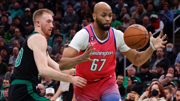 Washington Wizards forward Taj Gibson (67) grabs a loose ball next to Boston Celtics forward Sam Hauser (30) during the first half of an NBA basketball game Sunday, Nov. 27, 2022, in Boston. (Mary Schwalm/AP)