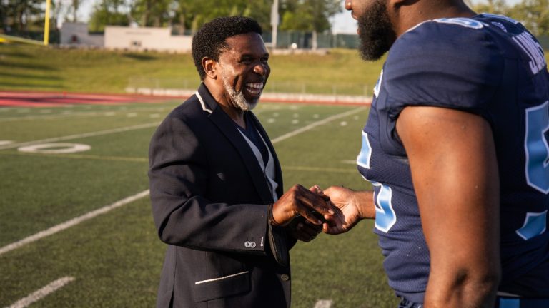 Toronto Argonauts general manager Michael "Pinball" Clemons and defensive lineman Ja'Gared Davis (56) talk ahead of preseason CFL football action against the Hamilton Tiger-Cats in Guelph, Ont., Friday, June 3, 2022. (Nick Iwanyshyn/CP)