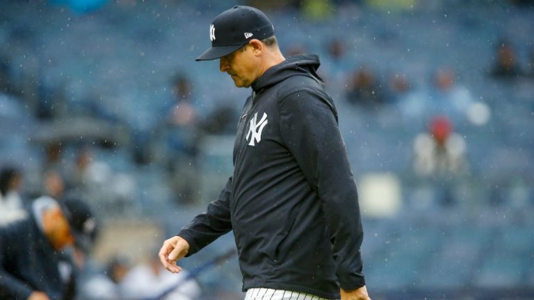 New York Yankees manager Aaron Boone walks back to the dugout after making a pitching change in the seventh inning during a baseball game against the Arizona Diamondbacks, Sunday, Sept. 24, 2023, in New York. (John Munson/AP Photo)