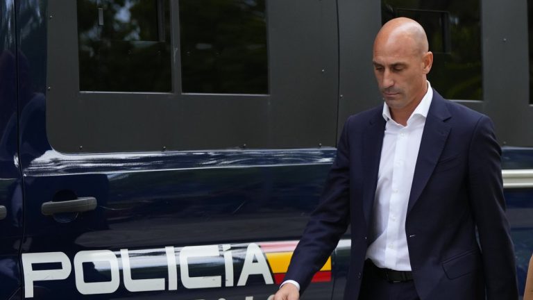 The former president of Spain's soccer federation Luis Rubiales, left, passes a police van as he leaves after testifying at the National Court in Madrid, Spain, Friday, Sept. 15, 2023.  (Manu Fernandez/AP)