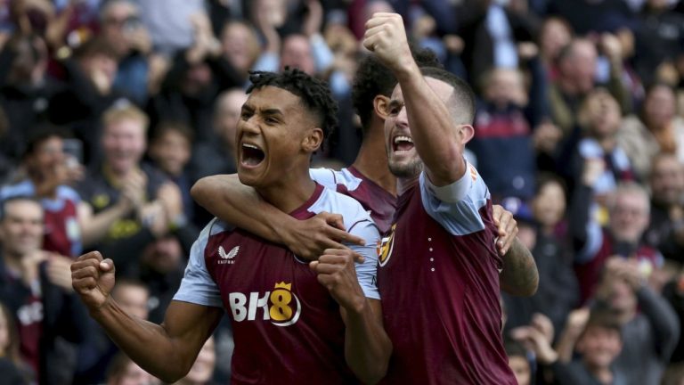 Aston Villa's Ollie Watkins, left, celebrates scoring his third goal of the game during their English Premier League soccer match against Brighton at Villa Park, Birmingham, England, Saturday, Sept. 30, 2023. (Barrington Coombs/PA via AP)