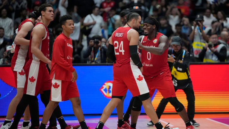 Canada forward Dillon Brooks (24) and Canada guard Luguentz Dort (0) celebrate after defeating Spain during their Basketball World Cup second round match at the Indonesia Arena stadium. (Achmad Ibrahim/AP)