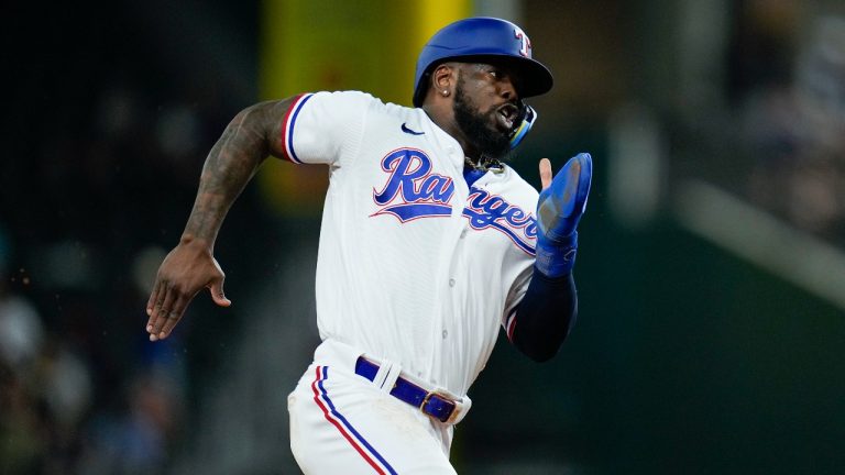 Texas Rangers' Adolis Garcia runs the bases while scoring from first base on a double by Jonah Heim against the Boston Red Sox during the sixth inning of a baseball game, Tuesday, Sept. 19, 2023, in Arlington, Texas. (Julio Cortez/AP Photo)