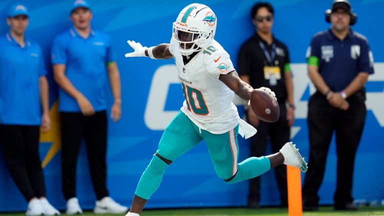 Miami Dolphins wide receiver Tyreek Hill celebrates his touchdown catch during the second half of an NFL football game against the Los Angeles Chargers. (Ashley Landis/AP)