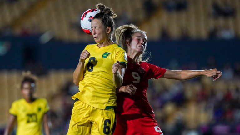 Jamaica's Havana Solaun, left, and Canada's Jordyn Huitema fight for the ball during a CONCACAF Women's Championship soccer semifinal match in Monterrey, Mexico, Thursday, July 14, 2022. (Fernando Llano/AP Photo)