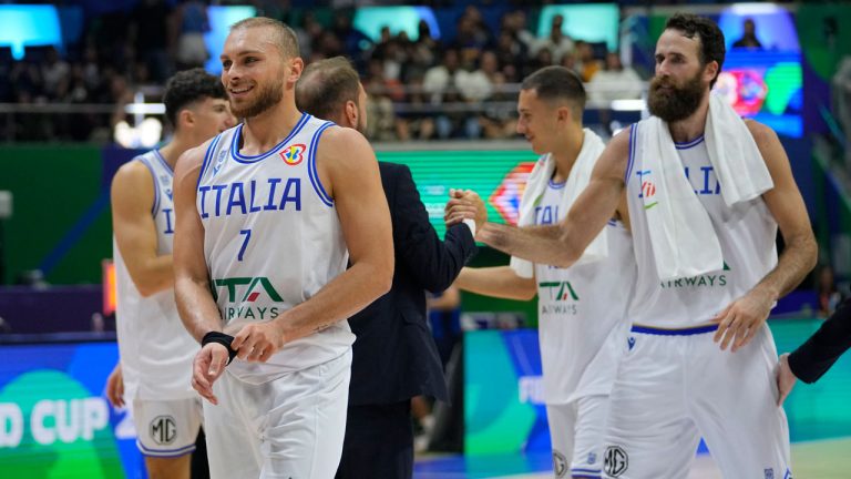 Italy team celebrates after winning against Puerto Rico during their Basketball World Cup second round match. (Aaron Favila/AP)