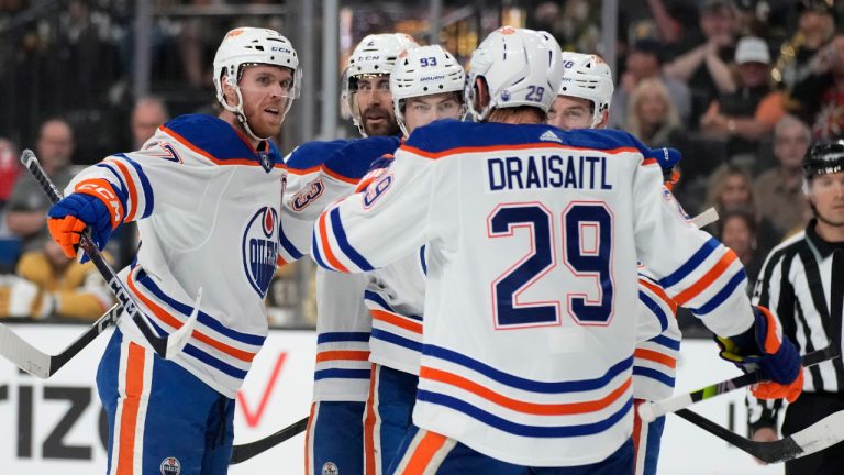 Edmonton Oilers center Connor McDavid, left, celebrates after scoring against the Vegas Golden Knights during the first period of Game 5 of an NHL hockey Stanley Cup second-round playoff series Friday, May 12, 2023, in Las Vegas. (John Locher/AP)