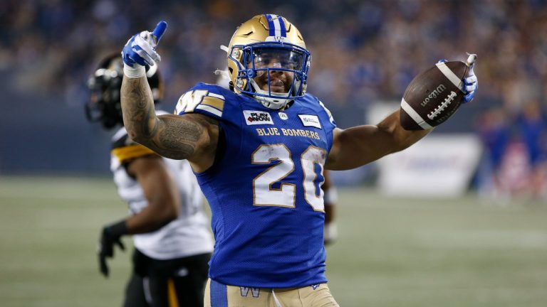 Winnipeg Blue Bombers' Brady Oliveira (20) celebrates his touchdown against the Hamilton Tiger-Cats during second half CFL action in Winnipeg Friday, June 9, 2023. (John Woods/THE CANADIAN PRESS)