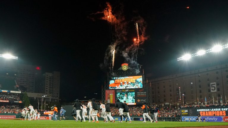 Baltimore Orioles players celebrate after defeating the Boston Red Sox 2-0 in a baseball game to win the AL East championship Thursday, Sept. 28, 2023, in Baltimore. (Julio Cortez/AP)