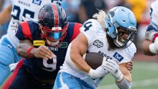 Ouellette rushes for two TDs, Argos cement playoff berth with win over Alouettes