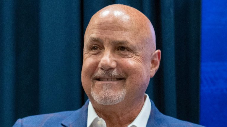 FILE - Washington Nationals general manager Mike Rizzo smiles during a media availability at Nationals Park, Saturday, July 22, 2023, in Washington. The Nationals are giving longtime president of baseball operations and general manager Mike Rizzo a chance to finish what he started. The club signed Rizzo to a multi-year extension on Wednesday, Sept. 13. (Alex Brandon/AP)