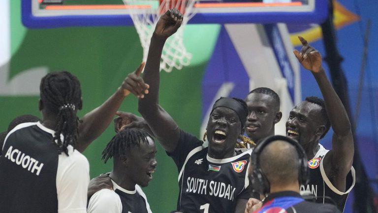 South Sudan team celebrates after winning against Angola during their Basketball World Cup classification match at the Araneta Coliseum, Manila, Philippines. (Aaron Favila/AP)