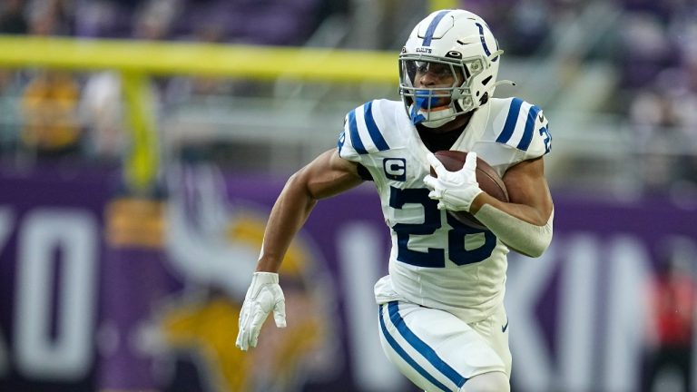 FILE -Indianapolis Colts running back Jonathan Taylor runs up field during the first half of an NFL football game against the Minnesota Vikings, Saturday, Dec. 17, 2022, in Minneapolis. The NFL has filed a grievance against the NFL Players Association, alleging that union leaders, including President JC Tretter, have advised running backs to “consider feigning or exaggerating injuries” to help increase their leverage in contract negotiations. The grievance was filed on Sept. 11, 2023 (Abbie Parr/AP)