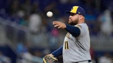 Tellez pitches final inning as Brewers clinch playoff spot with 16-1 win