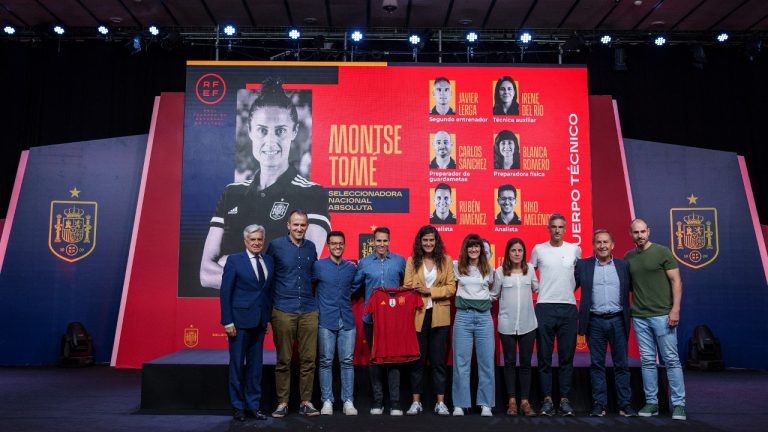 Spain's new women's national team coach Montse Tome, center, holds a jersey during her official presentation with her technical staff at the Spanish soccer federation headquarters in Las Rozas, just outside of Madrid, Spain, Monday, Sept. 18, 2023. Tome replaced Jorge Vilda less than three weeks after Spain won the Women's World Cup title and amid the controversy involving suspended federation president Luis Rubiales who has now resigned. (Manu Fernandez/AP)