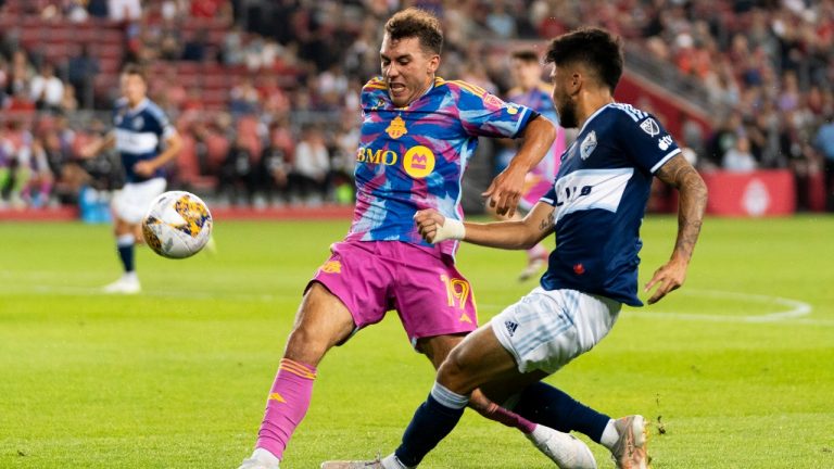 Vancouver Whitecaps midfielder Ryan Raposo (27) attempts a shot against Toronto FC midfielder Kobe Franklin (19) during first half MLS soccer action in Toronto, on Saturday, Sept. 16, 2023. (Spencer Colby/THE CANADIAN PRESS)