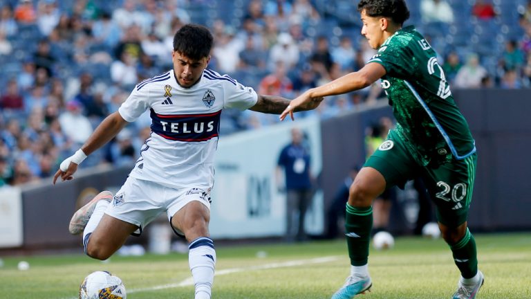 Vancouver Whitecaps FC forward Ryan Raposo, left, passes the ball around New York City FC midfielder Richard Ledezma during the second half of an MLS soccer match at Yankee Stadium, Saturday, Sept. 2, 2023, in New York. The game ended in a 1-1- tie. (John Munson/AP)