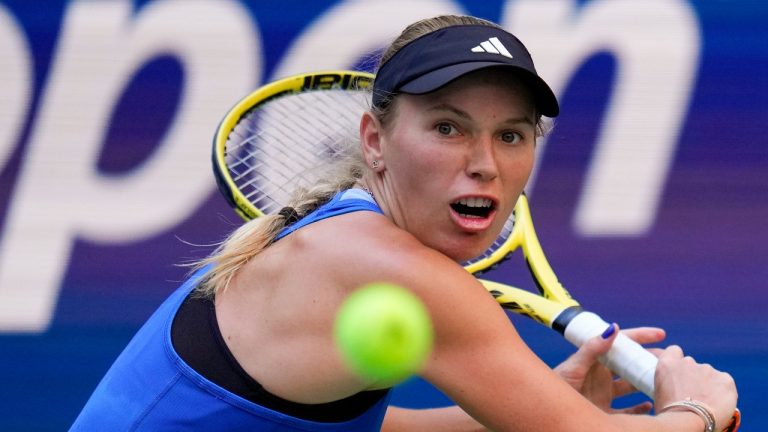 Caroline Wozniacki, of Denmark, returns a shot to Jennifer Brady, of the United States, during the third round of the U.S. Open tennis championships, Friday, Sept. 1, 2023, in New York. (Manu Fernandez/AP)