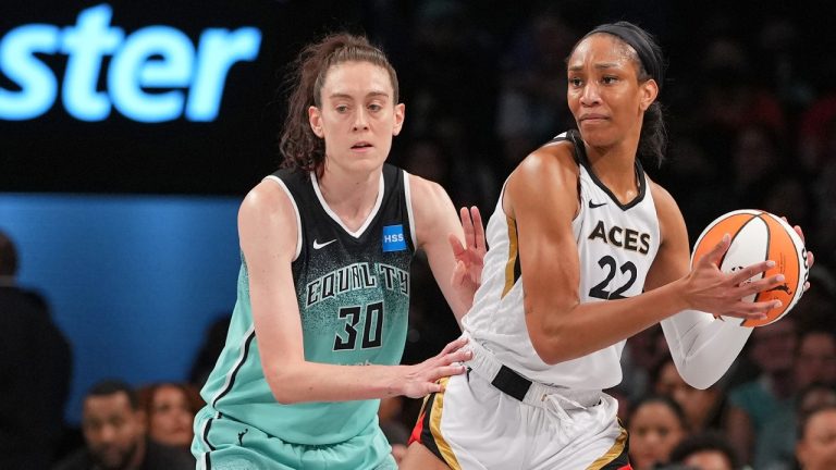 A'ja Wilson of the Las Vegas Aces handles the ball against New York Liberty star Breanna Stewart. (Evan Yu/NBAE via Getty Images)