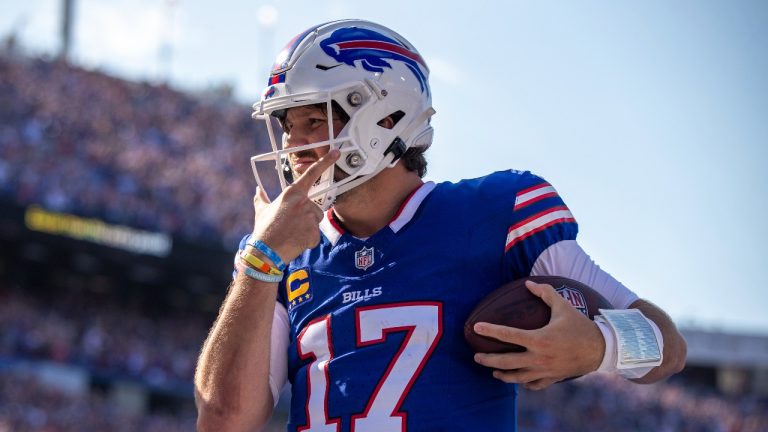 Buffalo Bills quarterback Josh Allen (17) celebrates after rushing for an 11 yard touchdown. (Matt Durisko/AP)