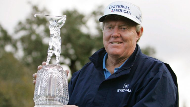 Andy Bean holds up his trophy on the 18th green of Sonoma Golf Club after winning the Charles Schwab Cup Championship golf tournament in Sonoma, Calif., Sunday, Nov. 2, 2008. (Eric Risberg/AP)