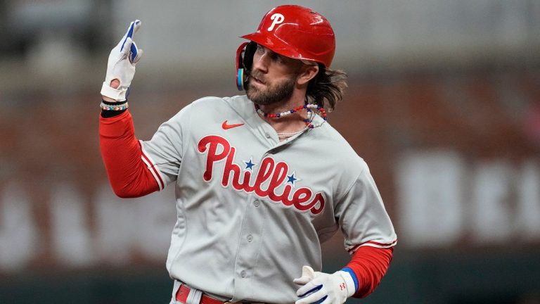 Phillies' Bryce Harper was hit by a pitch during his first at-bat, causing him to exit the game vs. the Blue Jays. (John Bazemore/AP)