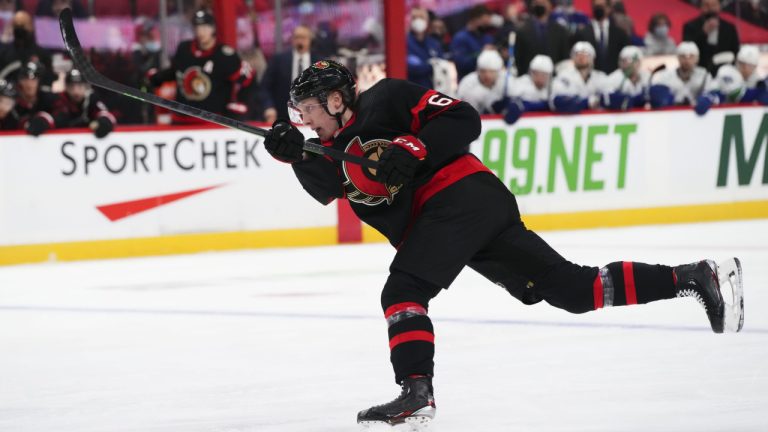 Ottawa Senators defenceman Lassi Thomson (60) takes a shot while taking on the Vancouver Canucks during second period NHL action in Ottawa on Wednesday, Dec. 1, 2021. (Sean Kilpatrick/CP)