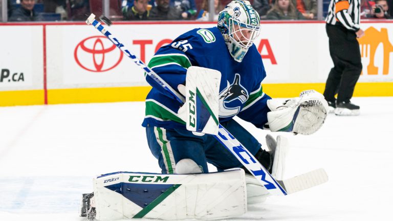 Vancouver Canucks' goalie Thatcher Demko makes a stick save agains the St. Louis Blues during second period NHL hockey action in Vancouver, B.C., Wednesday, Mar. 30, 2022. THE CANADIAN PRESS/Rich Lam 