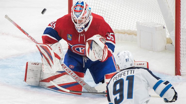 Winnipeg Jets' Cole Perfetti takes a shot on Montreal Canadiens goaltender Sam Montembeault during first period NHL hockey action in Montreal, Tuesday, January 17, 2023. THE CANADIAN PRESS/Graham Hughes 