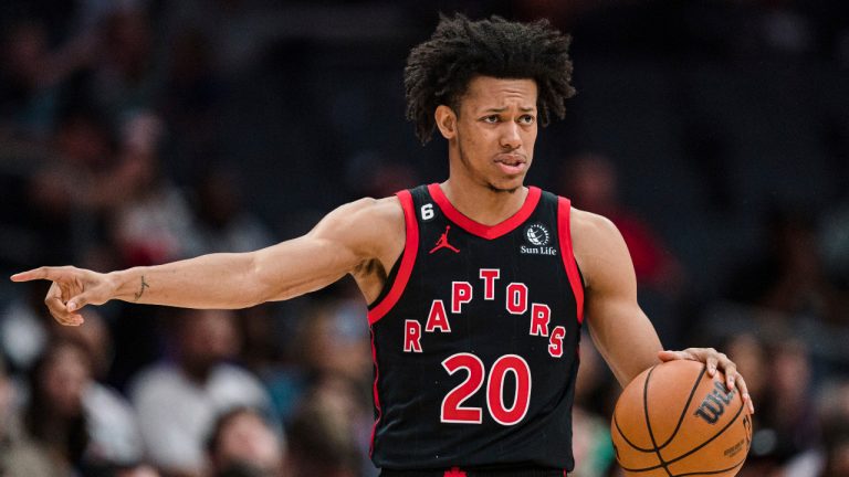 Toronto Raptors guard Jeff Dowtin Jr. directs a play against the Charlotte Hornets during the second half of an NBA basketball game in Charlotte, N.C., Tuesday, April 4, 2023. (Jacob Kupferman/AP) 