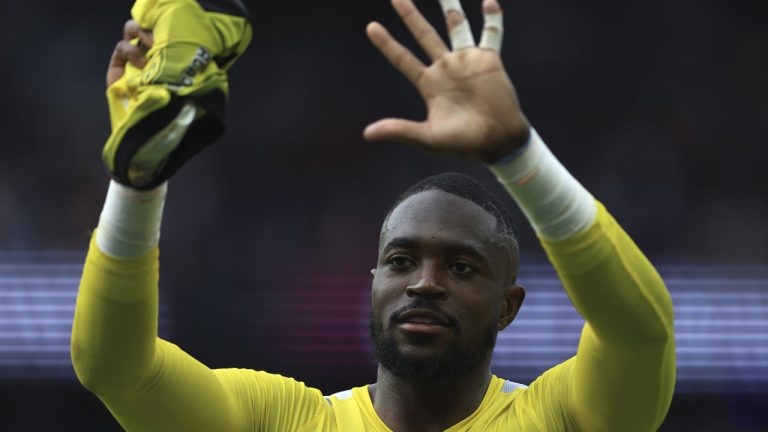 Lorient's goalkeeper Yvon Mvogo celebrates after the French League One soccer match between Paris Saint-Germain and Lorient, at the Parc des Princes stadium in Paris, Sunday, April 30, 2023. Lorient won 3-1. (Aurelien Morissard/AP)