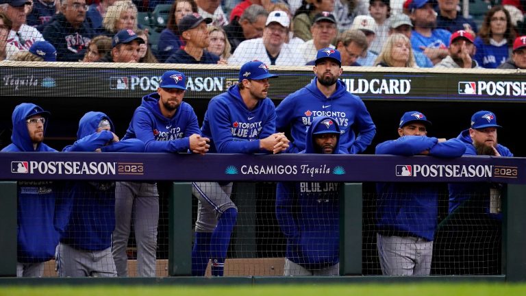 Toronto Blue Jays players watch from the dugout during the eighth inning of Game 2 of an AL wild-card baseball playoff series against the Minnesota Twins Wednesday, Oct. 4, 2023, in Minneapolis. (AP)