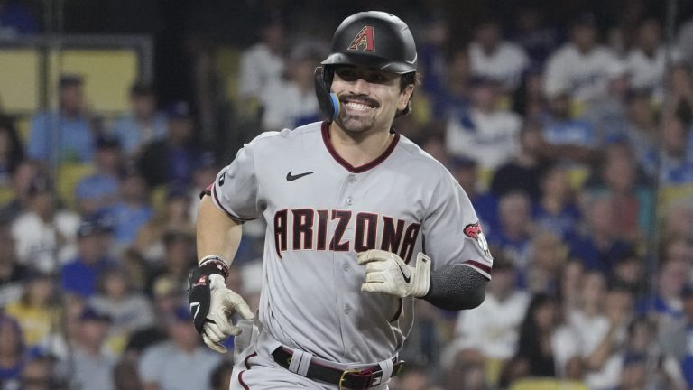 Arizona Diamondbacks' Corbin Carroll smiles as he rounds the bases after hitting a home run during the second inning in Game 1 of a baseball NL Division Series against the Los Angeles Dodgers, Saturday, Oct. 7, 2023, in Los Angeles. (Mark J. Terrill/AP)