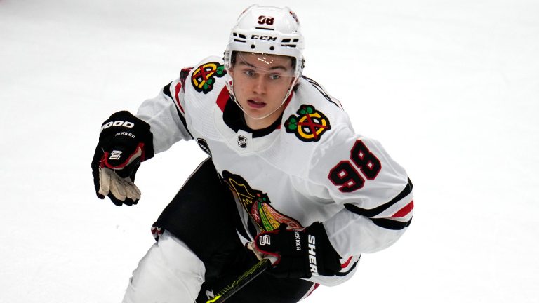 Chicago Blackhawks' Connor Bedard plays in his first regular season NHL hockey game against the Pittsburgh Penguins in Pittsburgh, Tuesday, Oct. 10, 2023. (AP Photo/Gene J. Puskar) 