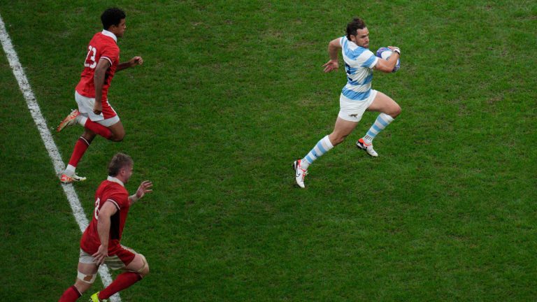 Argentina's Nicolas Sanchez sprints to score a try during the Rugby World Cup quarterfinal match between Wales and Argentina at the Stade de Marseille in Marseille, France, Saturday, Oct. 14, 2023. (Daniel Cole/AP) 