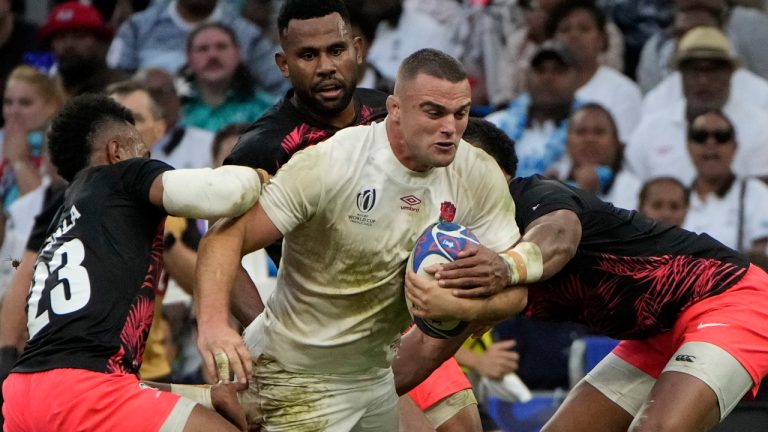 England's Ben Earl is tackled by Fiji's players during the Rugby World Cup quarterfinal match between England and Fiji at the Stade de Marseille in Marseille, France, Sunday, Oct. 15, 2023. (Laurent Cipriani/AP) 