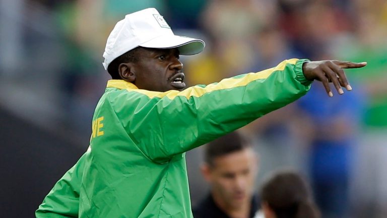 Zimbabwe's coach Shadreck Mlauzi gives instructions to his players during a group F match of the women's Olympic football tournament between Canada and Zimbabwe in Sao Paulo, Brazil, Saturday, Aug. 6, 2016. (AP)