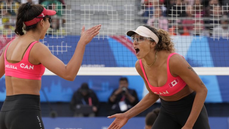 Canada's Melissa Humana-Paredes, left, and Brandie Wilkerson react during the gold medal beach volleyball final against Brazil at the Pan Am Games in Santiago, Chile on Friday, Oct. 27, 2023. (Frank Gunn/CP)