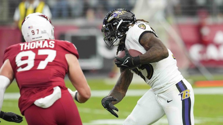 Baltimore Ravens running back Gus Edwards (35) runs for a touchdown during the first half of an NFL football game against the Arizona Cardinals Sunday, Oct. 29, 2023, in Glendale, Ariz. (Ross D. Franklin/AP)