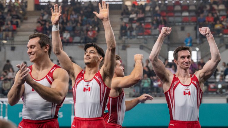 Team Canada men's artistic gymnastics team (left to right) René Cournoyer, Jayson Rampersad, William Émard and Zachary Clay salute the crowd after competing in the men's team event at the Pan American Games in Santiago, Chile on Saturday Oct. 21, 2023. (Frank Gunn/CP)