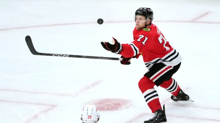 Chicago Blackhawks' Taylor Hall catches an airborne puck during an NHL preseason hockey game against the Detroit Red Wings Tuesday, Oct. 3, 2023, in Chicago. (Charles Rex Arbogast/AP)