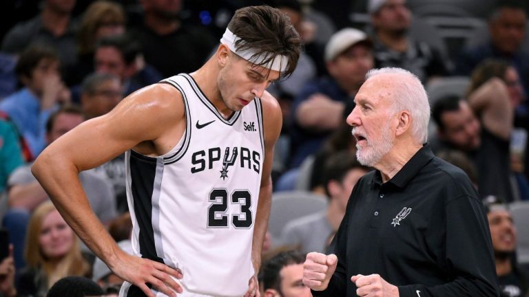 San Antonio Spurs head coach Gregg Popovich speaks with Spurs centre Zach Collins during the first half of a preseason NBA basketball game against the Houston Rockets, Wednesday, Oct. 18, 2023, in San Antonio. (Darren Abate/AP Photo)