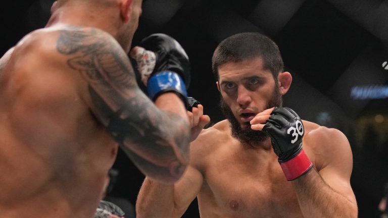 Islam Makhachev, right, seen here fighting Alex Volkanovski in a lightweight championship fight during UFC 294 at the Ethihad Arena in Abu Dhabi. (Kamran Jebreili/AP)