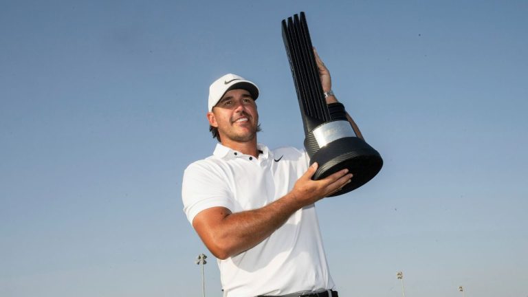 First Place Individual Champion Captain Brooks Koepka of Smash GC celebrates with the trophy after winning LIV Golf Jeddah at the Royal Greens Golf & Country Club on Sunday, October 15, 2023 in King Abdullah Economic City, Saudi Arabia. (Montana Pritchard/LIV Golf via AP)