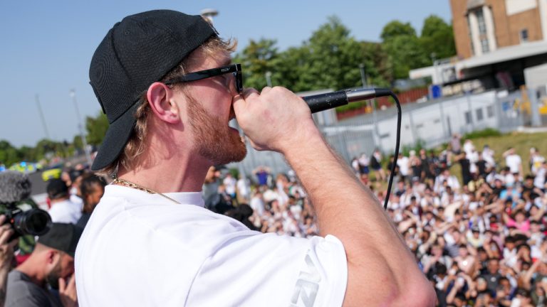 Logan Paul speaks to fans as he promotes an energy drink whilst on an open top bus traveling through London, Friday, June 17, 2022. (Scott Garfitt/AP)