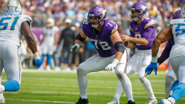 Minnesota Vikings guard Ezra Cleveland (72) prepares to block Los Angeles Chargers defensive tackle Sebastian Joseph-Day (51)during the first half of an NFL football game, Sunday, Sept. 24, 2023, in Minneapolis. (Bruce Kluckhohn/AP)