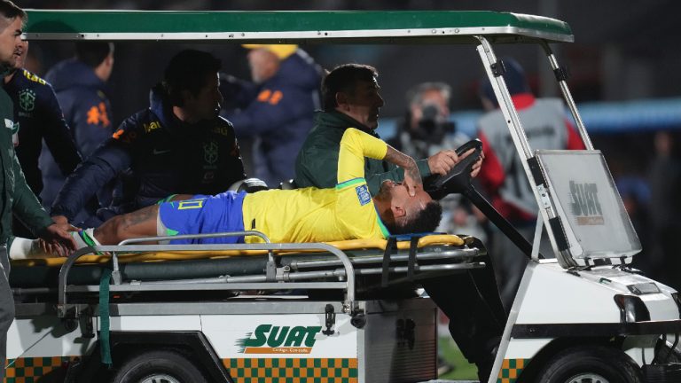 Brazil's Neymar is carried off the pitch on a stretcher after being injured during a qualifying soccer match for the FIFA World Cup 2026 against Uruguay at Centenario stadium in Montevideo, Uruguay, Tuesday, Oct. 17, 2023. (Matilde Campodonico/AP)