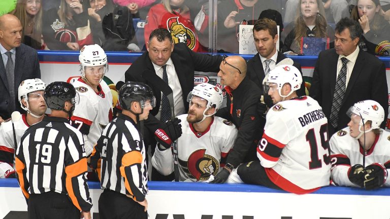 Ottawa Senators Coach D.J. Smith discusses a play during a timeout during third period NHL preseason hockey action against the Florida Panthers, in Sydney, N.S., Sunday, Oct. 1, 2023. (Vaughan Merchant/CP)